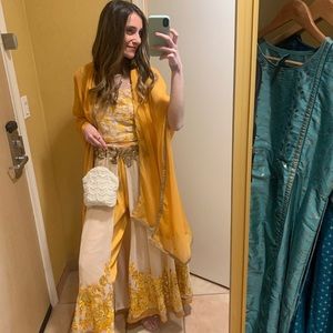 Embroidered yellow Indian wedding outfit. Blouse, pants, skirt, and dupatta
